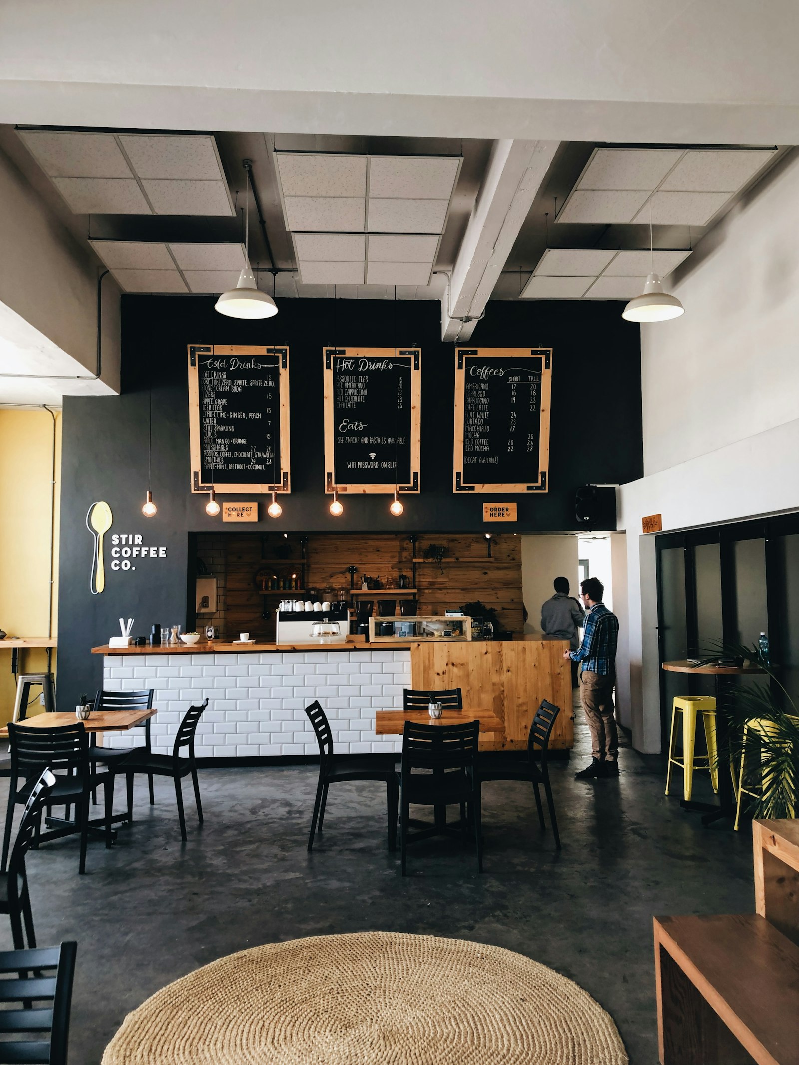 People working with coffee in a mountain-town cafe